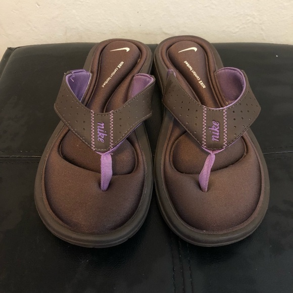 purple nike flip flops